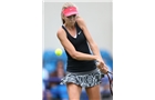 EASTBOURNE, ENGLAND - JUNE 14: Katie Boulter of Great Britain plays a forehand against Tamira Paszek of Austria during their Women's Singles first round qualifying match on day one of the Aegon International at Devonshire Park on June 14, 2014 in Eastbourne, England.  (Photo by Steve Bardens/Getty Images)